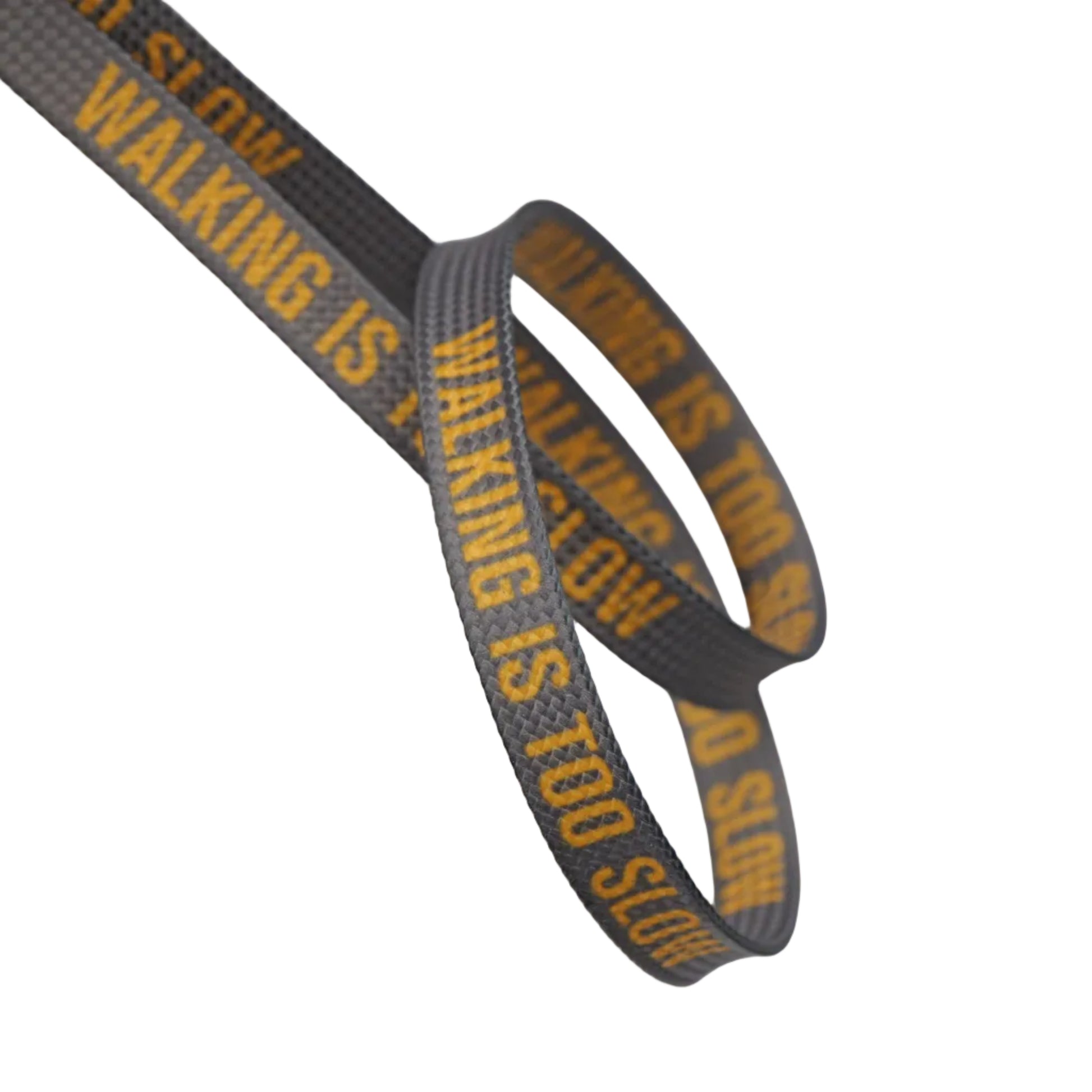 Laces for skates with yellow text reading 'WALKING IS TOO SLOW' coiled against a light gray background.